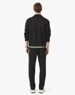 Pantaloni Lacoste neri in felpa piqué interlock di cotone con piping in contrasto