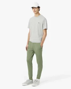 Pantaloni Lacoste verde salvia in felpa di cotone con logo coccodrillo verde sul fianco