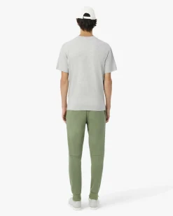 Pantaloni Lacoste verde salvia in felpa di cotone con logo coccodrillo verde sul fianco