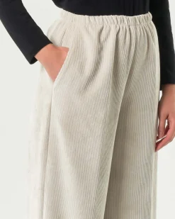 Pantaloni super wide neri Jurerê in velluto stretch a coste con elastico inserito in vita