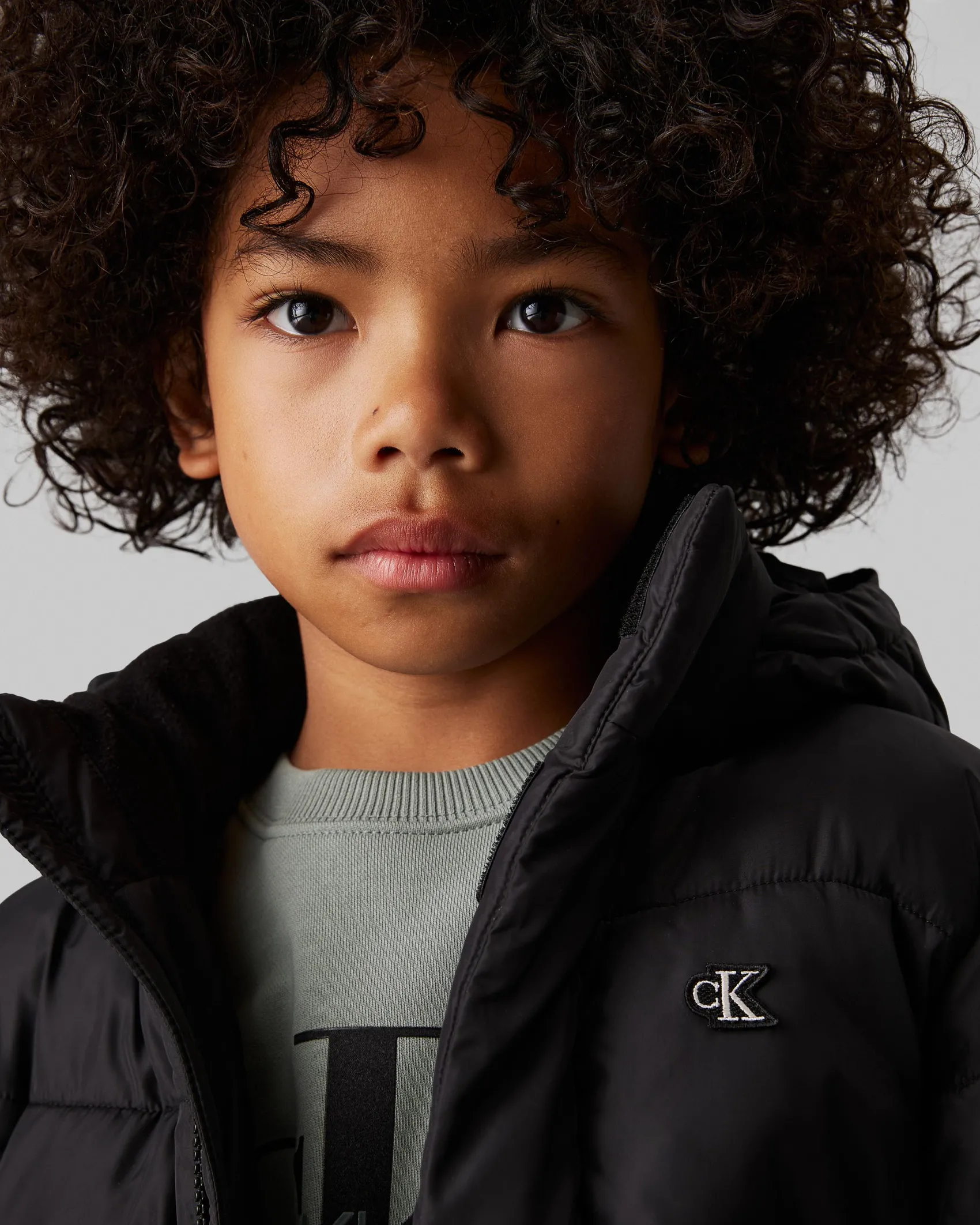 Piumino Calvin Klein nero imbottito con cappuccio