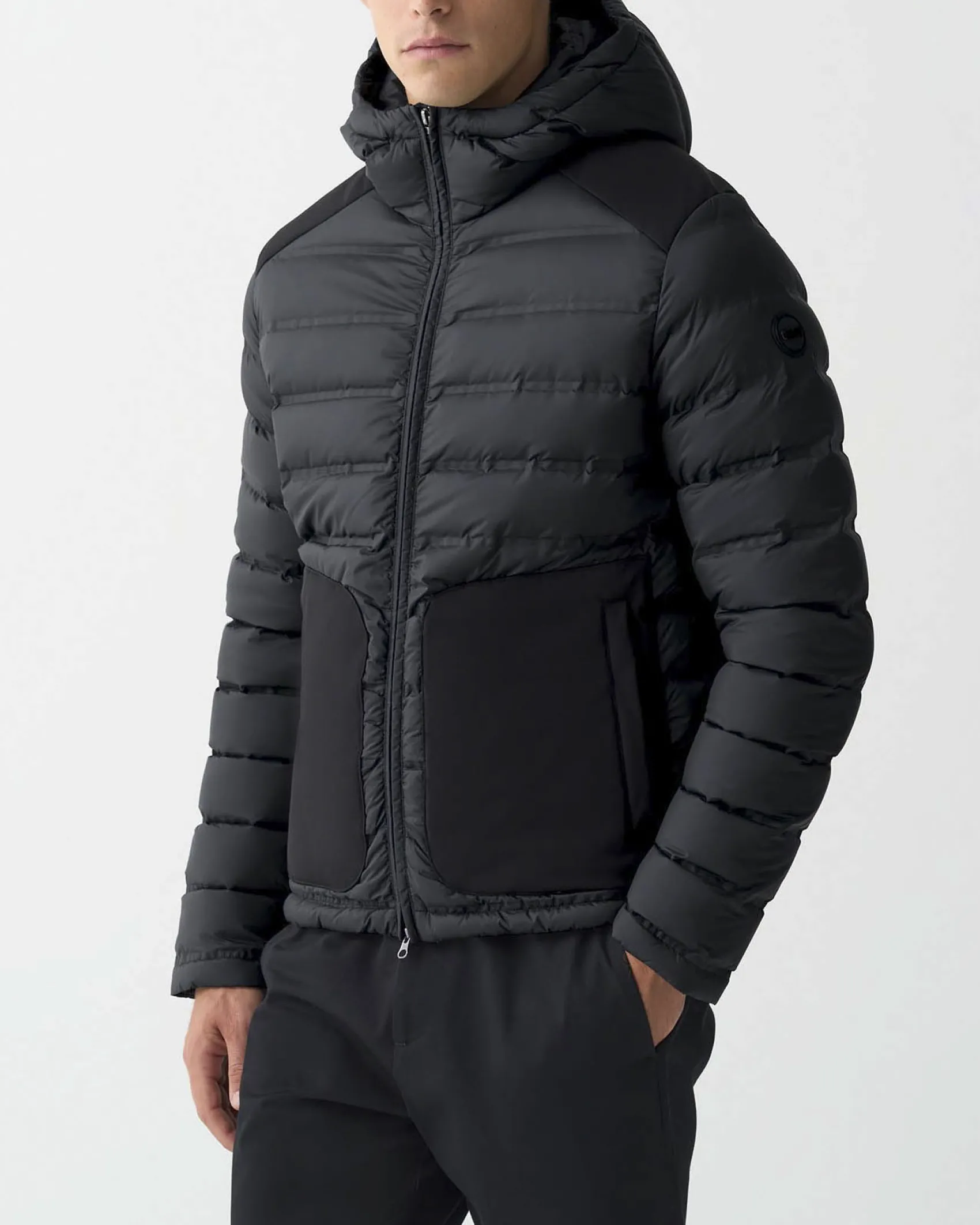 Piumino Colmar Originals nero bi-tessuto con cappuccio e inserti su spalle e tasche in tessuto stretch