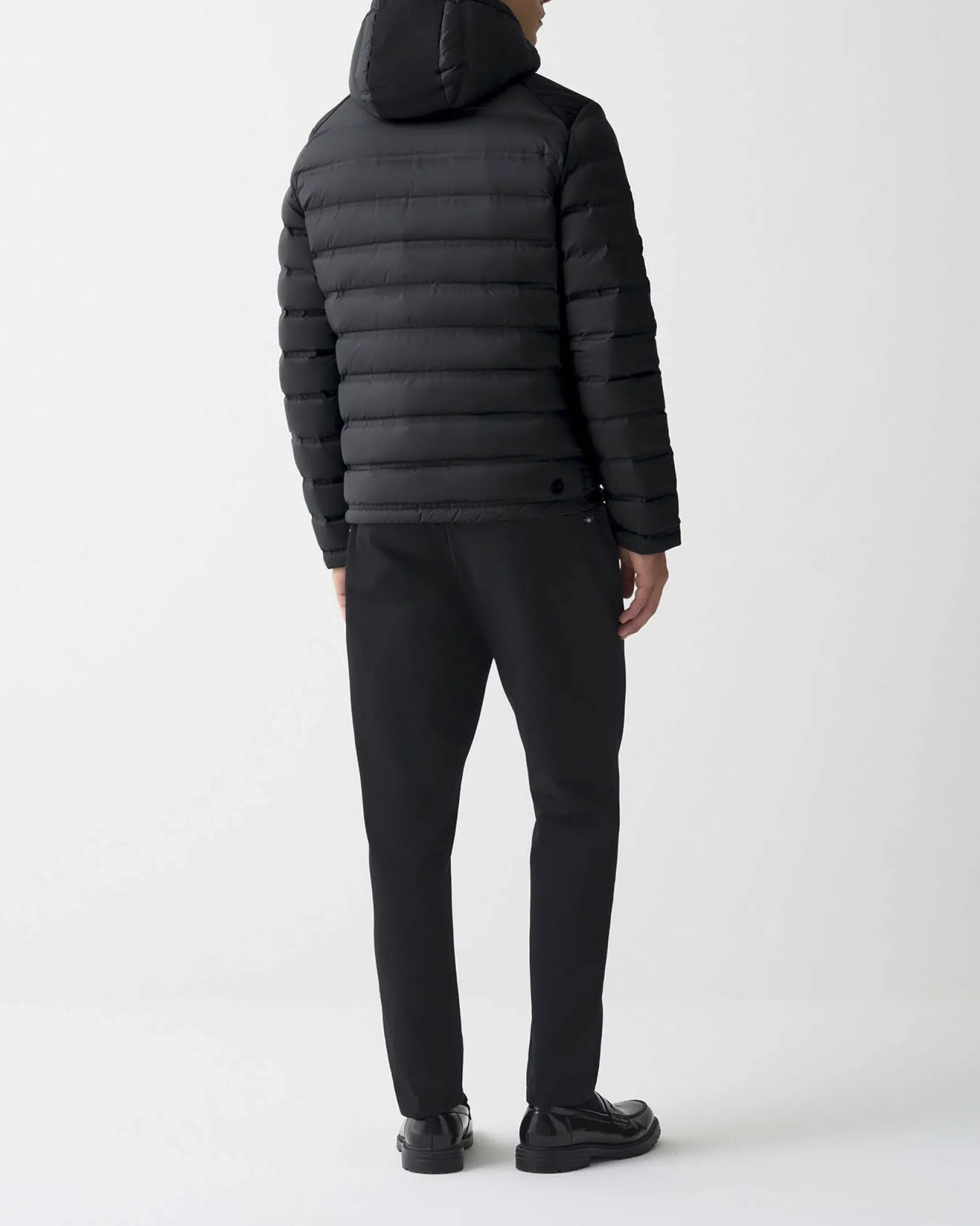 Piumino Colmar Originals nero bi-tessuto con cappuccio e inserti su spalle e tasche in tessuto stretch