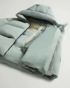 Piumino color acqua Woolrich Cloud Series in nylon elasticizzato con finish opaco con collo alto e cappuccio fisso