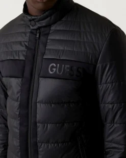 Piumino Guess nero in similpelle con logo in rilievo