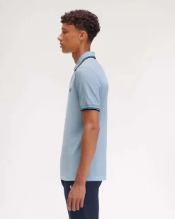 Polo Fred Perry azzurra mezza manica con bordino blu e ottanio