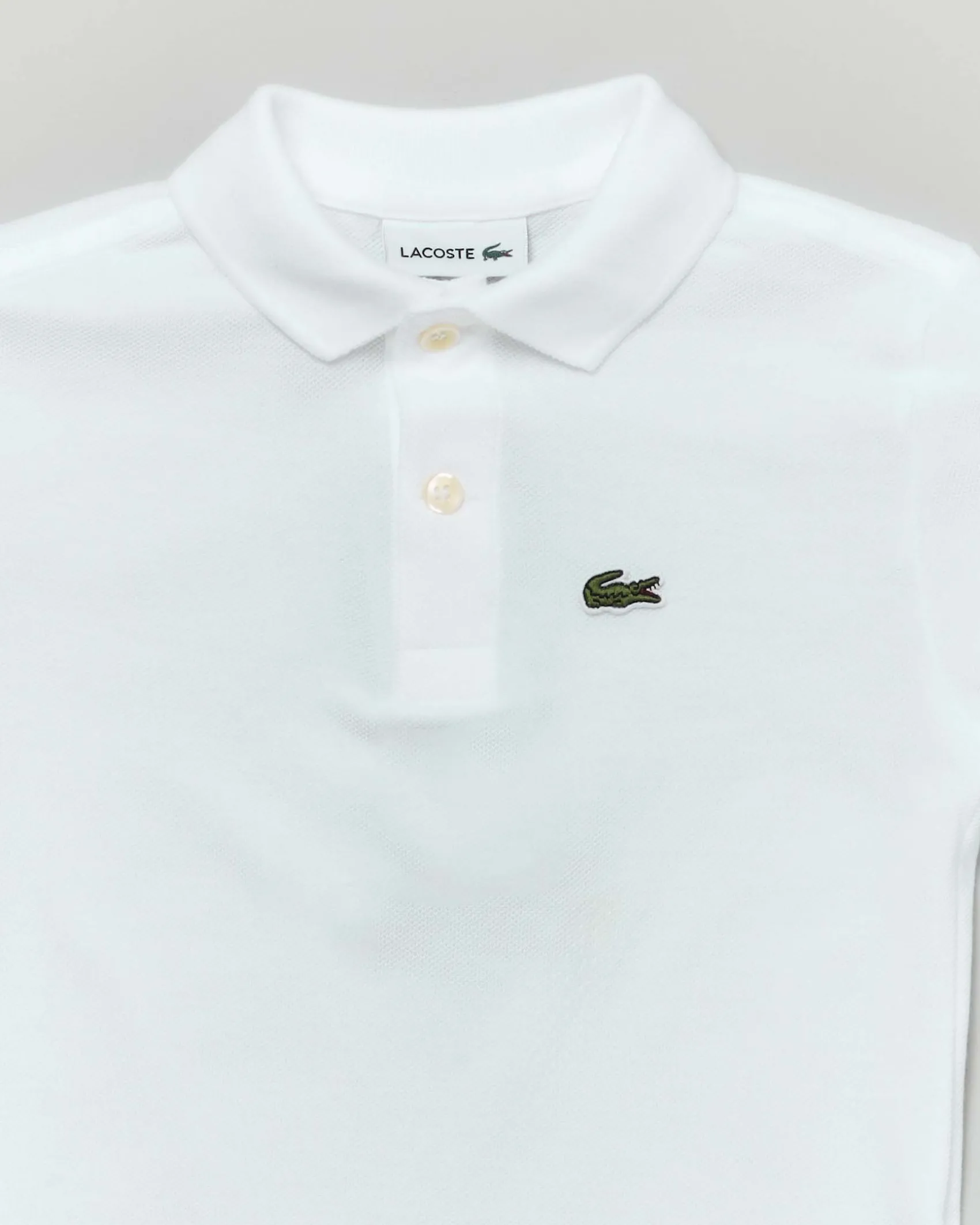 Polo Lacoste bianca piqué di puro cotone