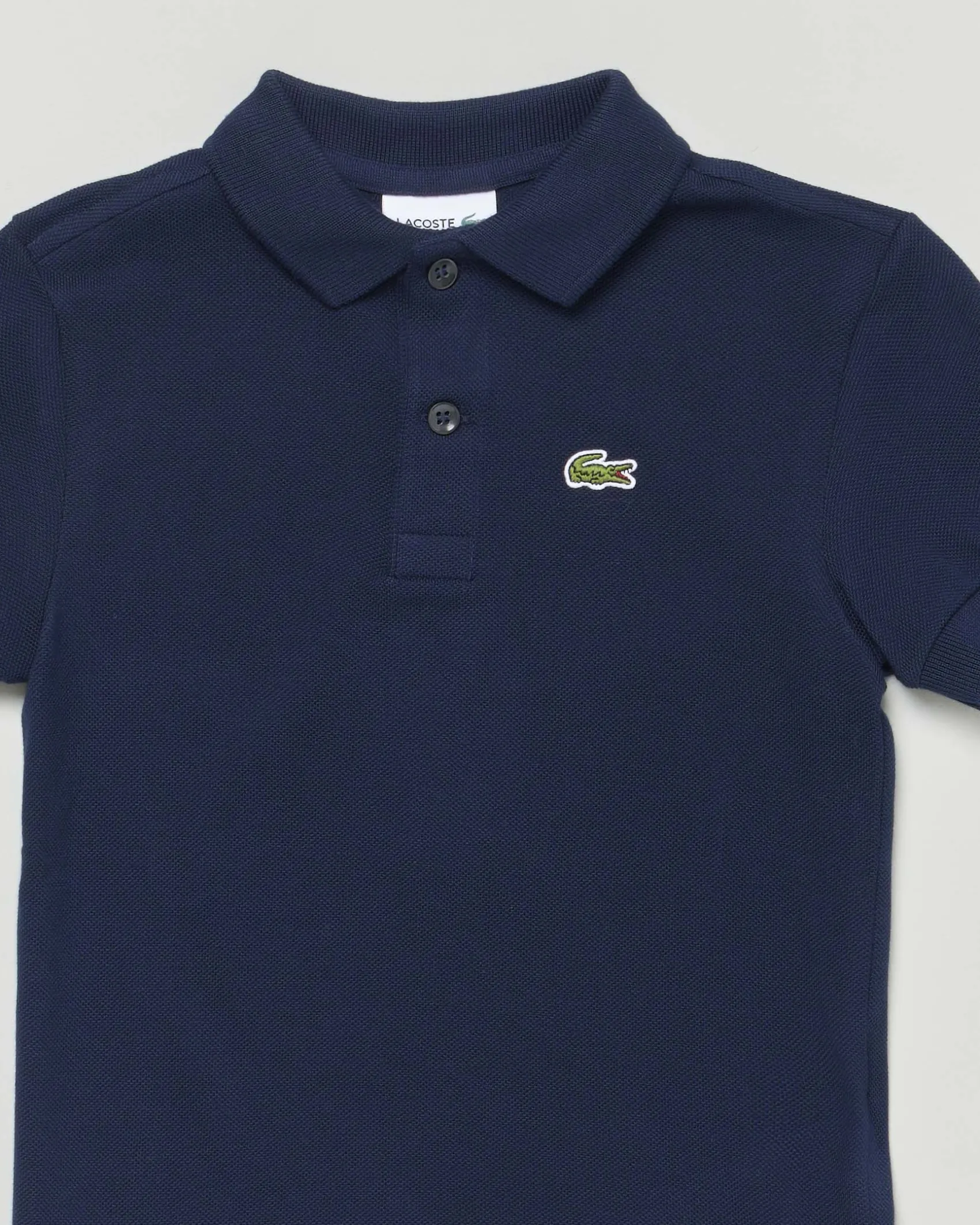 Polo Lacoste blu piqué di puro cotone