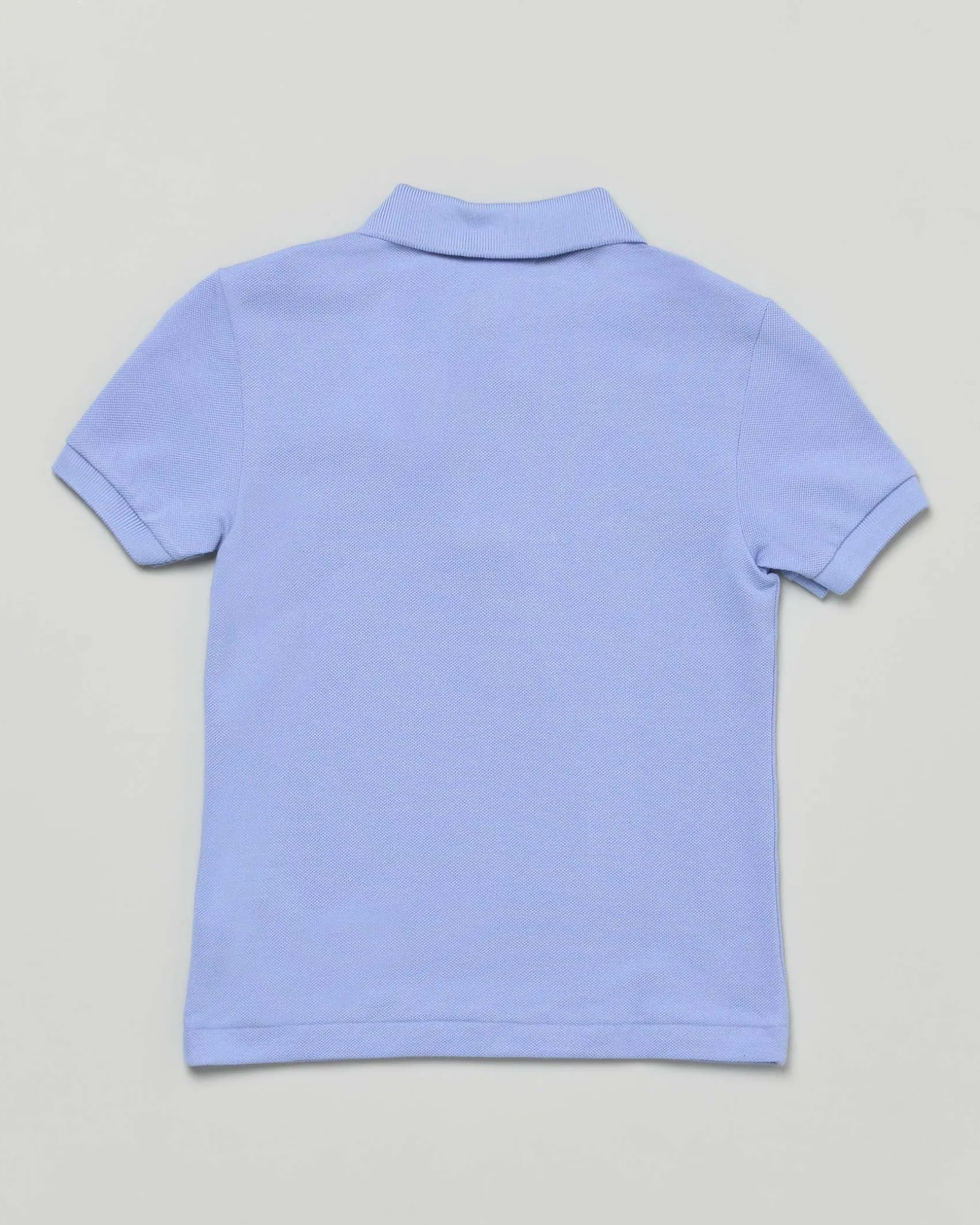 Polo Lacoste celeste piqué di puro cotone