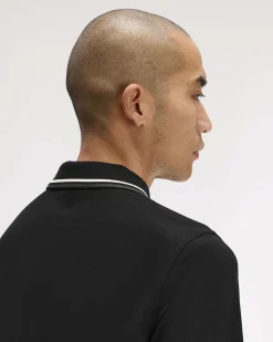 Polo manica lunga Fred Perry nera con bordino bianco e militare