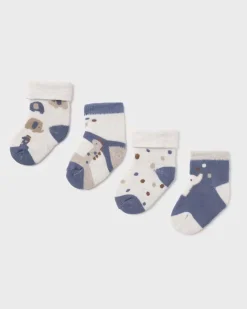 Set di quattro calze blu beige e panna a fantasia animaletti in misto cotone stretch