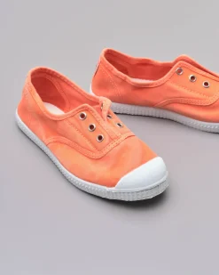Sneakers slip-on arancioni senza lacci in canvas di cotone effetto stone washed