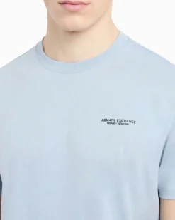 T-shirt mezza manica Armani Exchange azzurra tinta unita con logo piccolo stampato sul petto