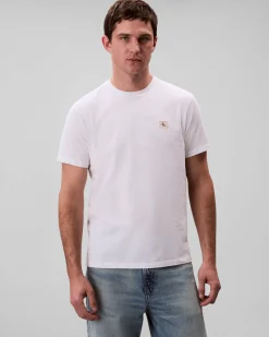 T-shirt Calvin Klein Jeans bianca in cotone con patch logo applicato sul petto