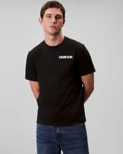 T-shirt Calvin Klein Jeans nera in cotone con logo stampato sul petto e maxi grafica sul retro