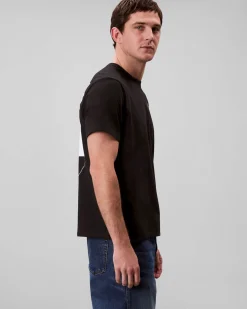 T-shirt Calvin Klein Jeans nera in cotone con logo stampato sul petto e maxi grafica sul retro