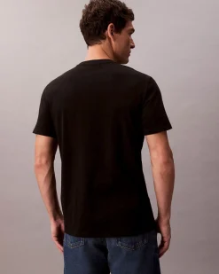 T-shirt Calvin Klein Jeans nera in cotone con patch logo applicato sul petto