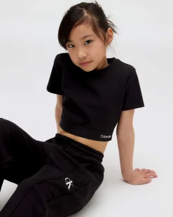 T-shirt cropped Calvin Klein nera con elastico porta logo
