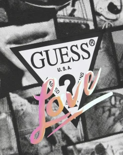 T-shirt cropped nera Guess in cotone stretch a maniche corte con fantasia foto