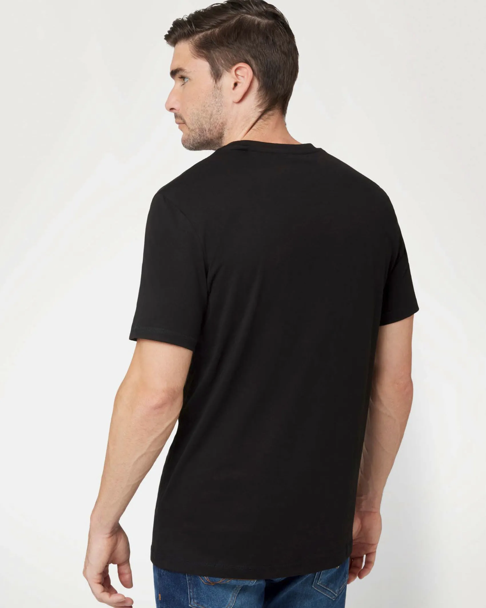 T-shirt Guess nera in cotone con logo in tono ricamato sul petto
