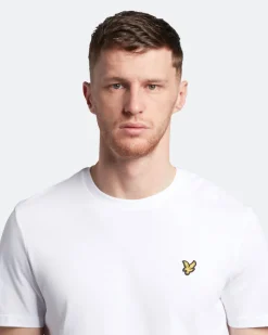 T-shirt mezza manica bianca in cotone con logo aquila gialla ricamata sul petto