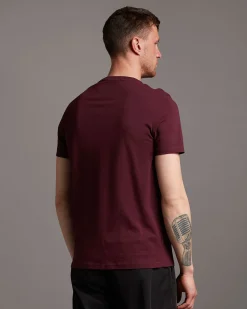 T-shirt mezza manica bordeaux in cotone con logo aquila gialla ricamata sul petto