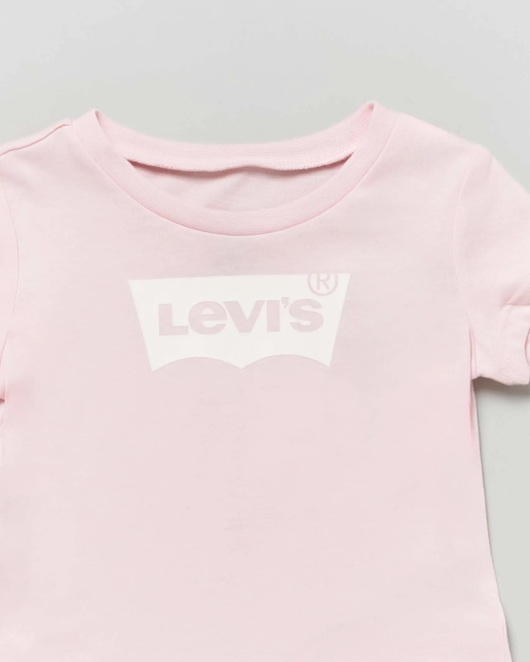 T-shirt rosa a maniche corte con logo batwing bianco
