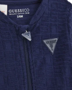 Tuta Guess con body in ciniglia di puro cotone blu e bianco