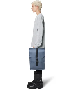 Zaino Backpack Mini color avio in tessuto tecnico impermeabile effetto gommato con patta